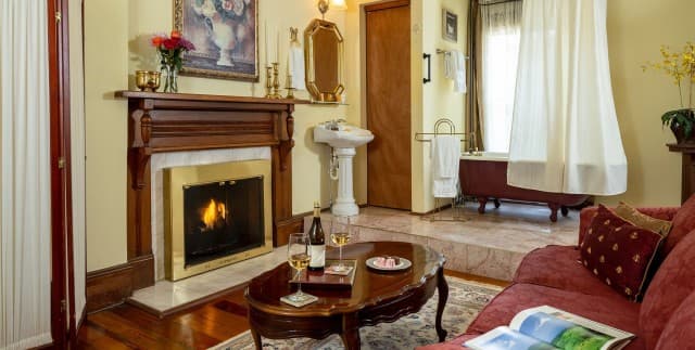 Fireplace and open-plan bath in Captain’s Guestroom at Engadine. Fireplace and open-plan bath in Captain’s Guestroom at Engadine.