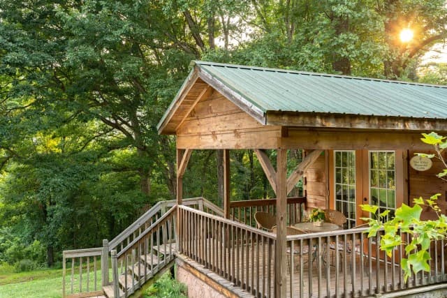 Blue Ridge Cabin surrounded by mountain woodland at Engadine Inn and Cabins. Blue Ridge Cabin surrounded by mountain woodland at Engadine Inn and Cabins.