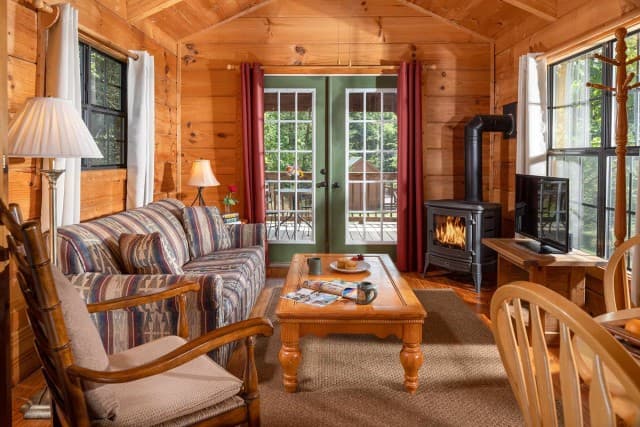Warm wood interior and living area inside Smoky Mountains Cabin at Engadine. Warm wood interior and living area inside Smoky Mountains Cabin at Engadine.